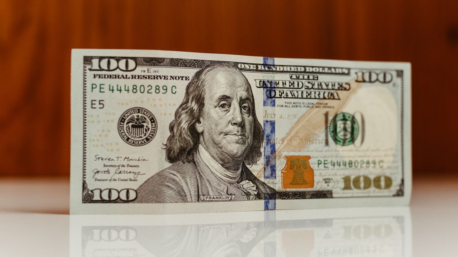 Close-up of a US one hundred dollar bill featuring Benjamin Franklin, representing core PCE inflation and the Fed's preferred gauge