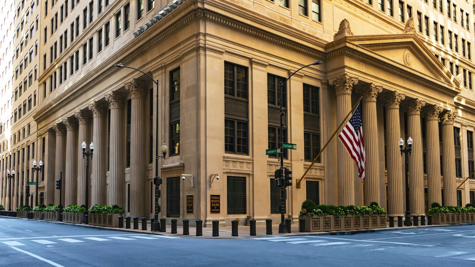 Federal Reserve Bank building with columns and a flag