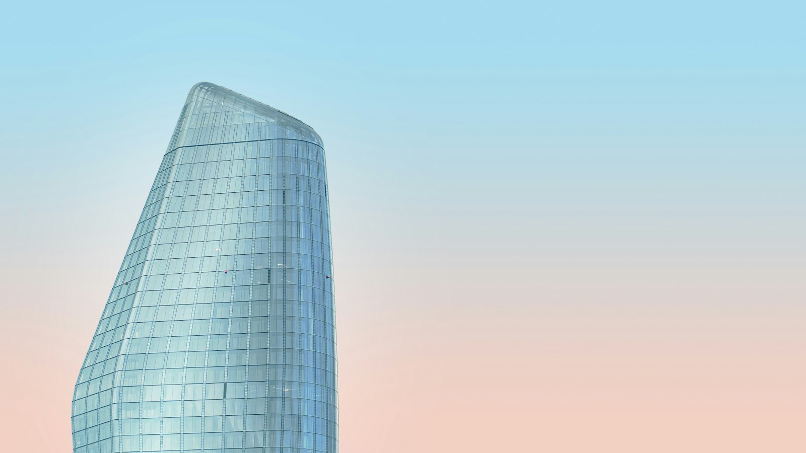 Glass bank skyscraper at sunset