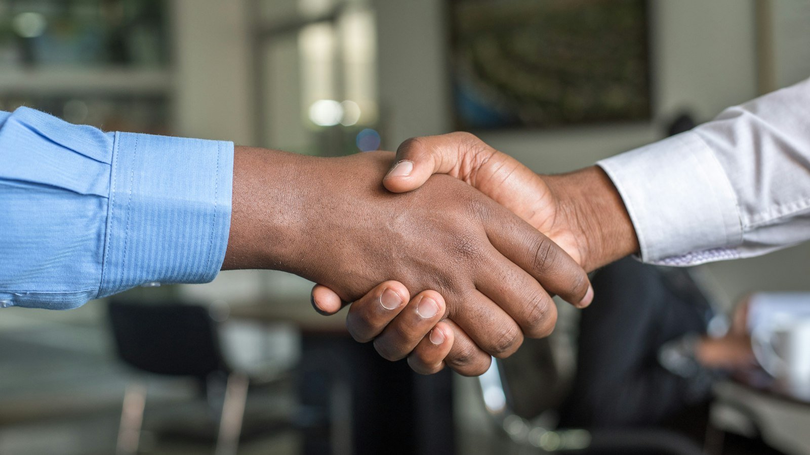 Two professionals shaking hands after a job interview