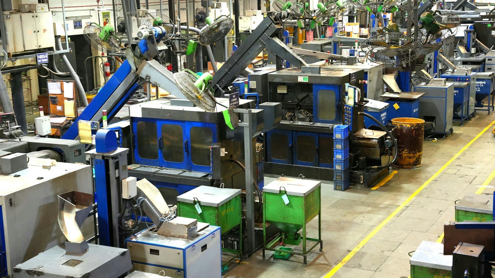 Industrial factory floor with machinery and yellow safety lines